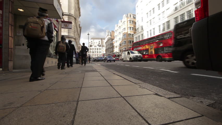 LONDON - OCTOBER 7, 2011: A busy street surrounded by buildings with traffic and