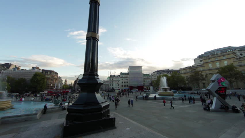 A panning shot - from right to left - of Trafalgar Square in London. People,