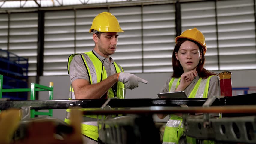 Warehouse workers and managers check stock and inventory by using digital tablet computers in the retail warehouse full of shelves with goods. Working in logistics and distribution center. - Powered by Shutterstock - Get 15% off with code: PIKWIZARD15