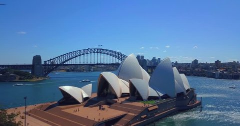 Sydney Opera House aerial view on August 19, 2017 in Sydney, Australia. Amazing aerial opera house view from above the harbour with the bridge on the background.