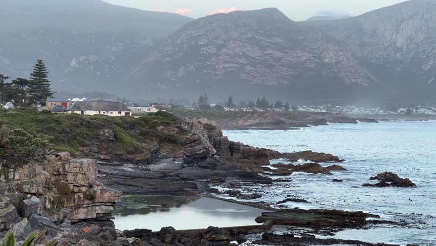 Sunset on the whale coast of Hermanus of the high sea cliffs Royalty-Free Stock Footage #3465188781