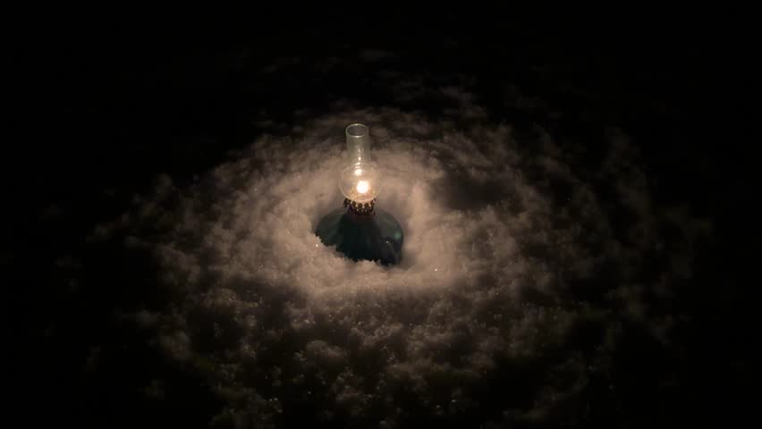 Retro kerosene lamp antique old oil lantern in snow light fire flame in darkness in heavy snow winter season outside the clay enamel oil container rural life village in Hyrcanian forest in Iran - Powered by Shutterstock - Get 15% off with code: PIKWIZARD15