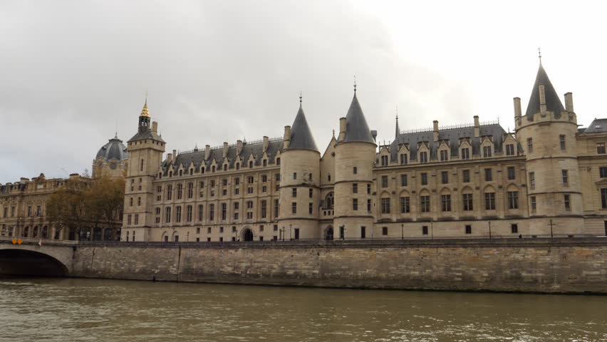 Conciergerie Palace, Courthouse, And Prison By The Seine River In Ile de la Cite, Paris, France. - pan right shot