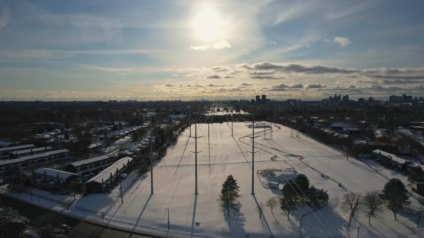 High voltage electricity pylon in the winter evening background. International Earth Hour WWF event or power blackout concept. High electric hydro power demand due electric vehicle or EV use.