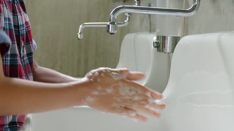 Little asian boy washing hand 