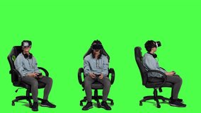 Woman playing video games using virtual reality headset in studio, enjoying cyberspace 3d gaming tournament against greenscreen backdrop. Gamer having fun with vr glasses. Camera A.
