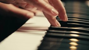 Young woman pianist playing classical music on a grand piano close-up. Classic music concert or repetition - Powered by Shutterstock - Get 15% off with code: PIKWIZARD15