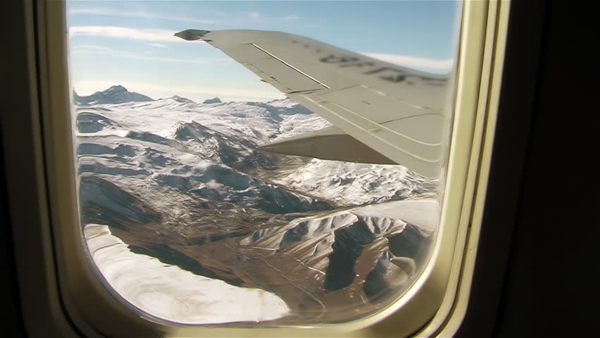 Aerial View of the Andes Mountains from Airplane Window During Flight - 4K