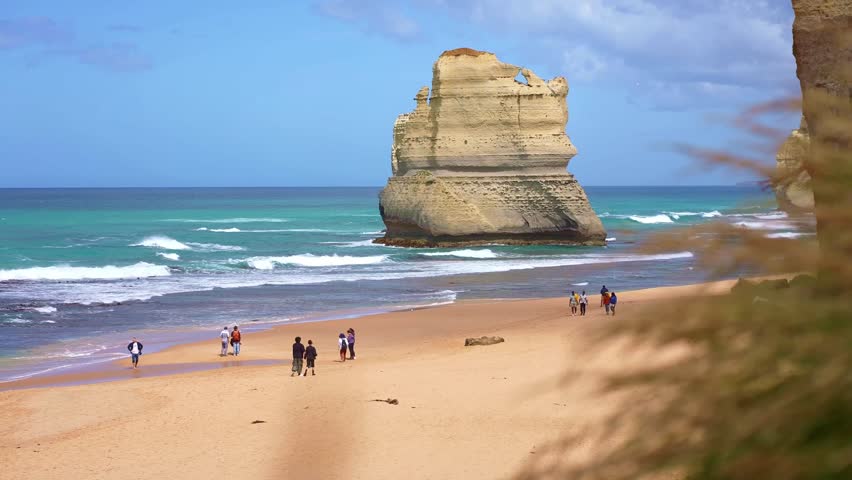Tourists at twelve apostles Australia, famous lookout cliffs on Great Ocean Road  coastline. day trip from Melbourne, Victoria. 