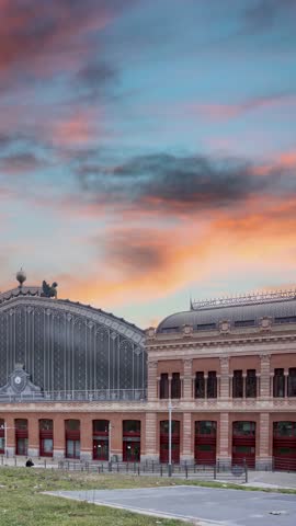 Madrid Atocha railway station, a bustling hub of travel and a masterpiece of architectural design. The station serves as a gateway for travelers exploring the rich culture and history of Spain capital