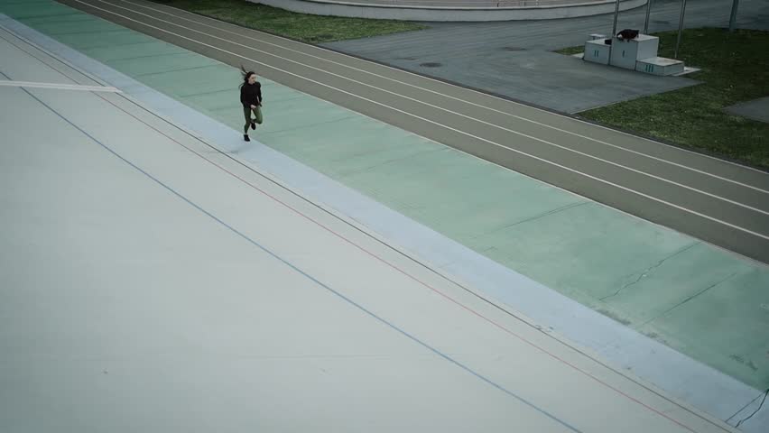 Athletic girl run an training in stadium