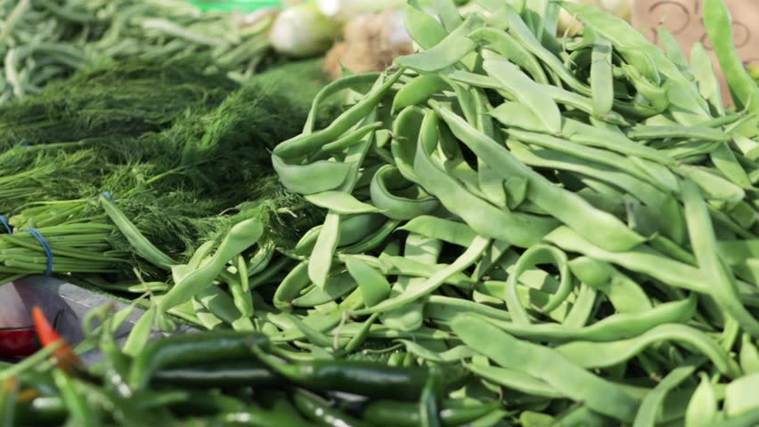 Farmer market, close-up assorted greens on display, concept of healthy eat and importance of incorporating fresh vegetables into one's diet. Royalty-Free Stock Footage #3465948009