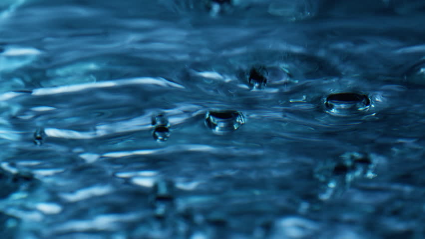 Bubble Creating And Exploding In The Water 