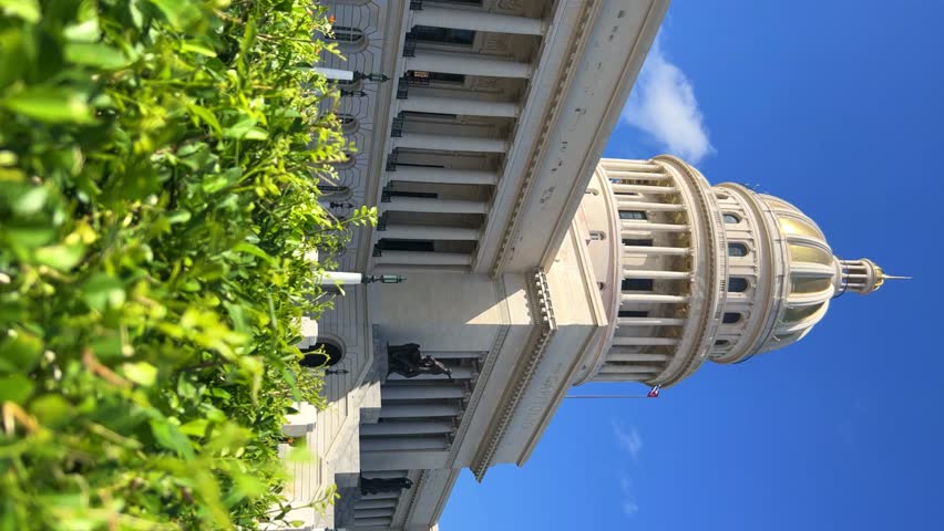 The famous building of the National Capitol in Cuba. HAVANA - DECEMBER 20, 2023: The entrance staircase and the dome of the Capitol in the center of Havana against the background of a blue sunny sky.