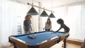 Group of diverse friends playing pool game - Powered by Shutterstock - Get 15% off with code: PIKWIZARD15