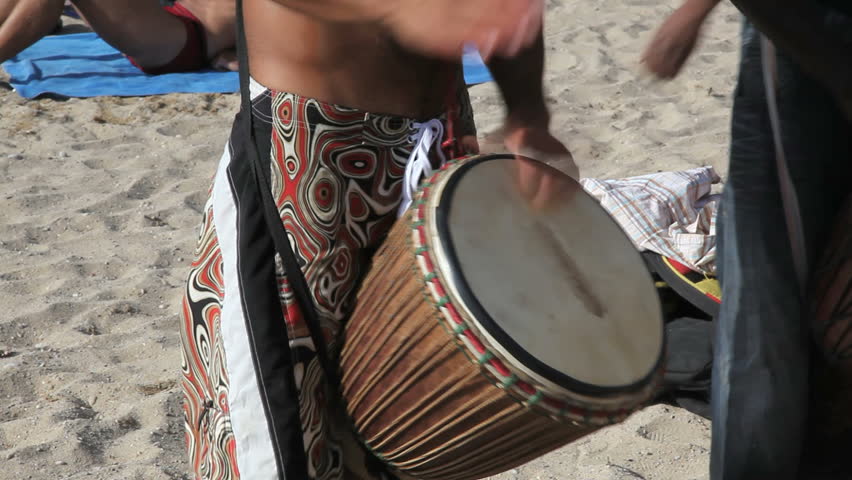 Drummer at the beach in Ibiza at daytime
