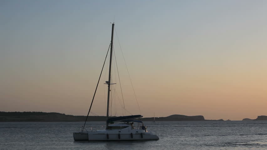 IBIZA, EIVISSA JUN 10, 2009: Sailing Boat in the Ibiza Sunset on June 10, 2009