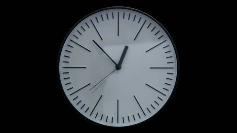 Time lapse shot of a modern clock on black background
