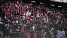 blur. football fans. The stands are full of people. A football match. Football players play football. fierce fight for the ball.  - Powered by Shutterstock - Get 15% off with code: PIKWIZARD15
