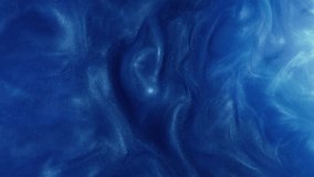 Glitter fluid texture. Ink water. Blue color sparkling particles haze paint splash swirl dynamic creative abstract background. - Powered by Shutterstock - Get 15% off with code: PIKWIZARD15