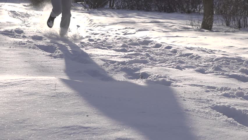 man is running through the deep snow