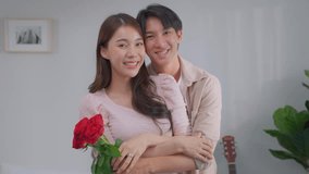 Portrait of Asian man making surprise proposal of marriage to girlfriend. Attractive young male proposing to beautiful happy woman with wedding ring enjoying surprise engagement and look at camera. - Powered by Shutterstock - Get 15% off with code: PIKWIZARD15