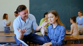 Man trying to flirt with woman during recess in university. Students meet in classroom. - Powered by Shutterstock - Get 15% off with code: PIKWIZARD15