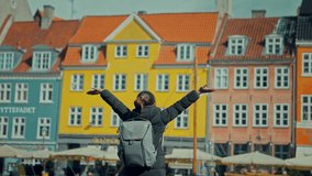 Happy Asian tourist woman backpacker traveler enjoying at Copenhagen Nyhavn, Famous landmark, northern Europe destination, the old town waterfront water canal in the capital Kobenhavn in Denmark. - Powered by Shutterstock - Get 15% off with code: PIKWIZARD15