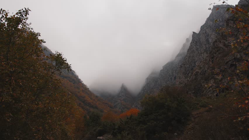 Beautiful view of a gorge in the mountains in foggy weather
