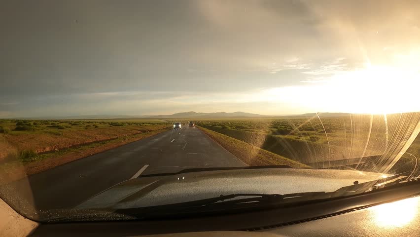 Spectacular landscape with Huge bright rainbow after the rain while driving in wonderful landscape 