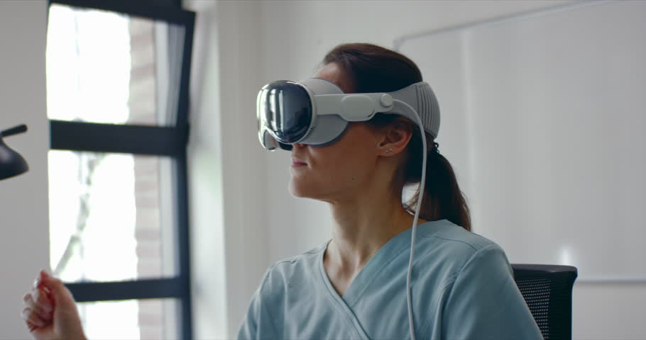 A healthcare professional using a spatial computing AR headset in medical diagnostics, signifying modern advancements in treatment. Telemedicine consultation