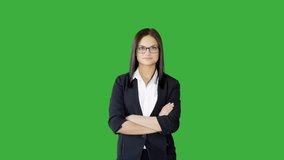 Young Woman Stands in Isolated Greenscreen