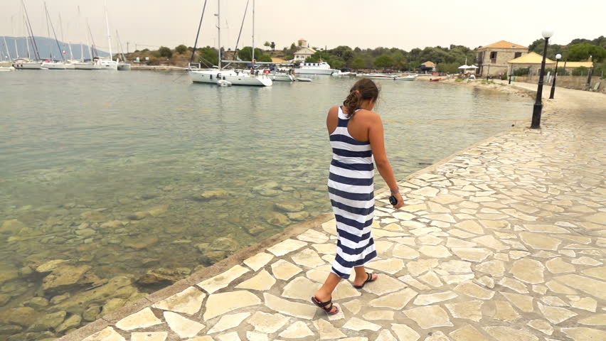 Teenage girl walking near port, super slow motion 240fps
