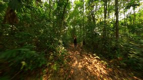 Caucasian woman runs in tropical rainforest in Thailand - Powered by Shutterstock - Get 15% off with code: PIKWIZARD15