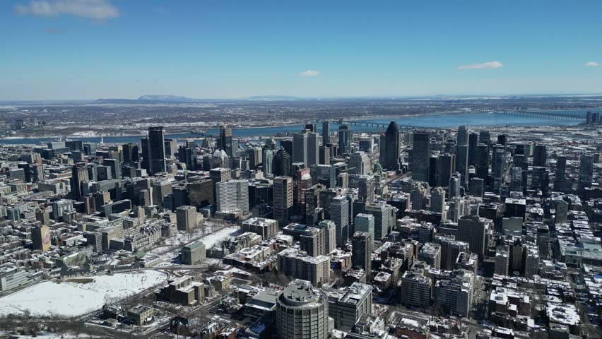 Aerial Drone of Montreal, Quebec Canada Downtown Cityscape Reveal View From Above the Trees of Mont-Royal
