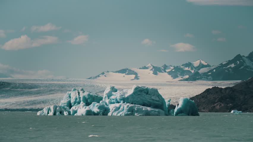 Floating Icebergs Over Lago Argentino Near Upsala Glacier In Patagonia, Argentina. POV