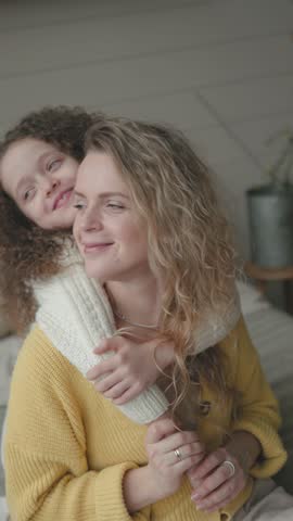 Happy cute affectionate adopted little kid girl hugging foster care parent mother, adorable small child daughter embrace mum cuddling enjoy tender sweet moment concept, close up view Royalty-Free Stock Footage #3467062745