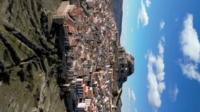 Aerial view of Morella city. Ancient walled city located on a hill-top in the province of Castellón, Valencian Community, Spain. Drone going forward. Famous travel destination. Vertical video