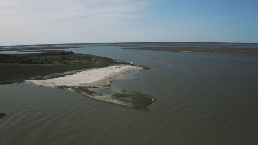 Aerial Panning Forward Shot Of Waves In Ashepoo River On Sunny Day - Charleston, South Carolina