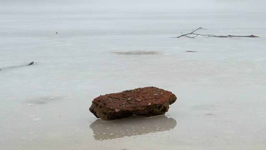 Frozen and foggy lake in Sweden. Mysterious landscape