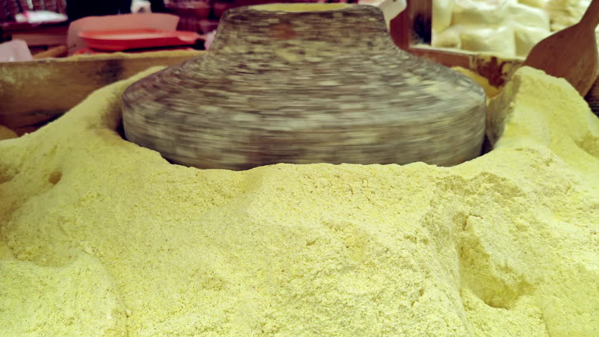 Corn Flour is Grinding in an Old Stone Mill Footage.
