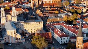 Kaunas old town panorama, Lithuania. 4K aerial view footage of Kaunas city center with many old red roof houses, churches. Drone video