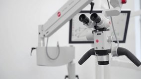 Dental surgical microscope with rotary binocular in modern dentist office. Using microscope in dental surgery. Professional equipment in the dentistry clinic. Diagnostics and. 3D Illustration - Powered by Shutterstock - Get 15% off with code: PIKWIZARD15