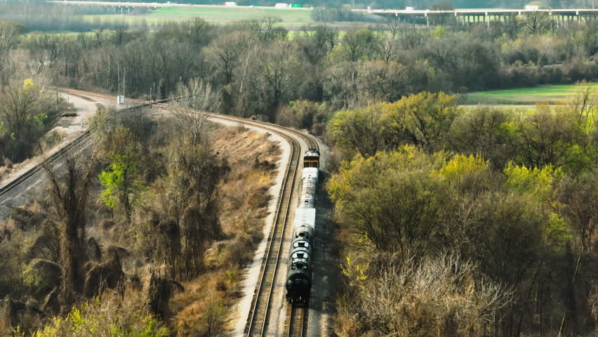 Two Rail Lines Of Harahan Bridge Across The Mississippi River Between West Memphis, Arkansas, and Memphis, Tennessee. Aerial Pullback Shot