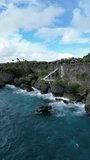 Aerial video above the coastline with rocks and observation in Ilocos Sur Philippines
