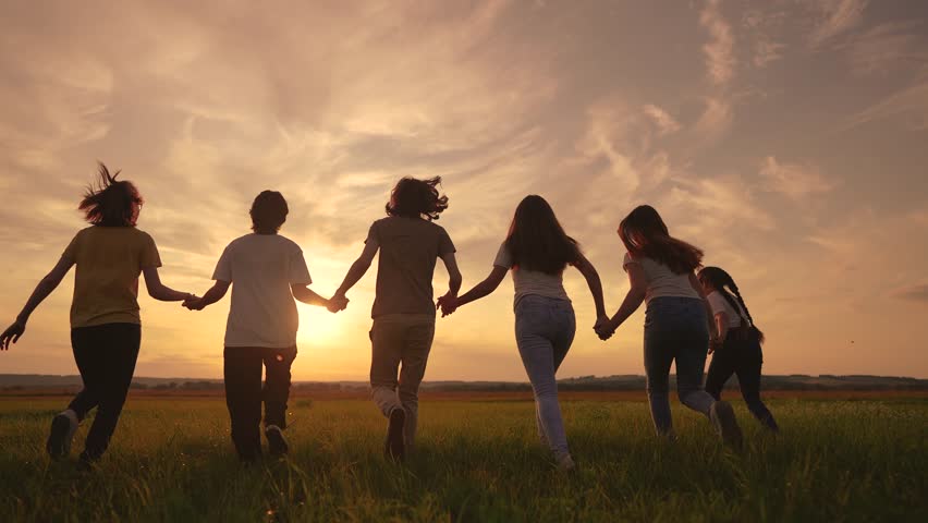 happy family running silhouette. big family runs holding hands in the park at sunset. happy family kid dream concept. group of people family holding hands running in the park lifestyle Royalty-Free Stock Footage #3467222129