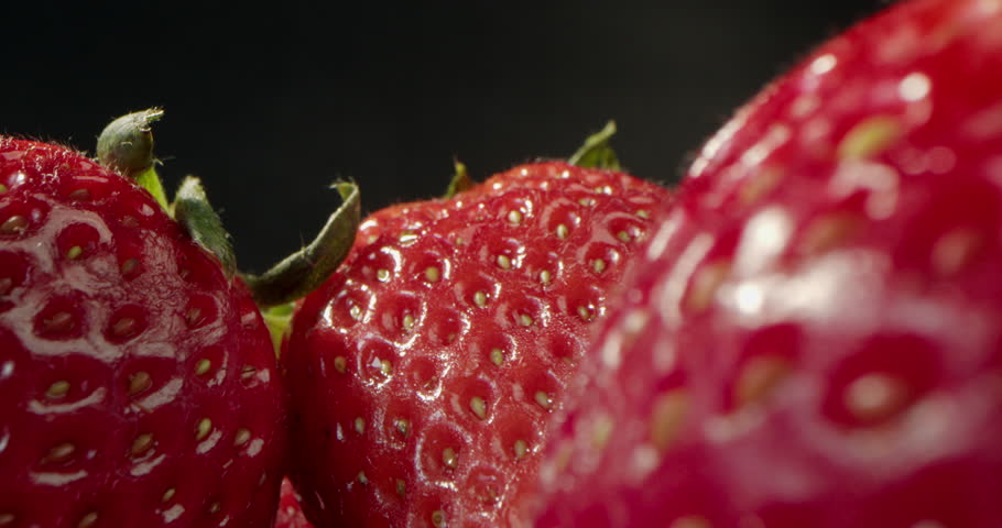 Background of Fresh Harvest Strawberries. Concept Of Healthy Natural Vegan Food. Soft focus. Strawberries, Red Juicy Ripe Strawberries, Close-up, Delicious Summer Berries. 4K