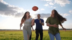 teenagers playing rugby in the park. group of teenagers play american football run outdoors in the park in summer. happy family kid dream concept. family teen play american football lifestyle run - Powered by Shutterstock - Get 15% off with code: PIKWIZARD15
