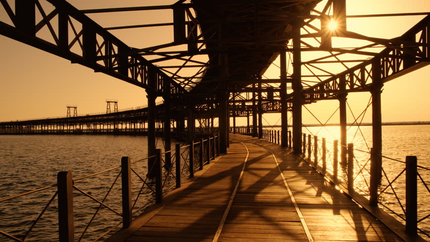 Sunset at Rio Tinto Pier, also known as Muelle de Rio Tinto, Huelva, Andalucia, Spain, commercial pier used for the trade of material from the mines of the Rio Tinto
