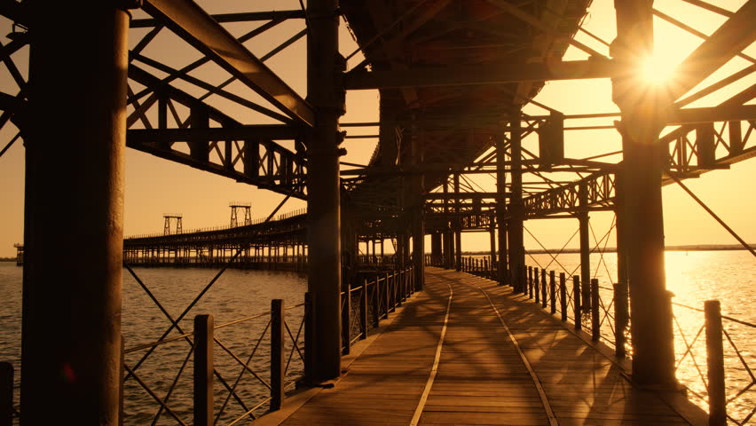 Sunset at Rio Tinto Pier, also known as Muelle de Rio Tinto, Huelva, Andalucia, Spain, commercial pier used for the trade of material from the mines of the Rio Tinto
